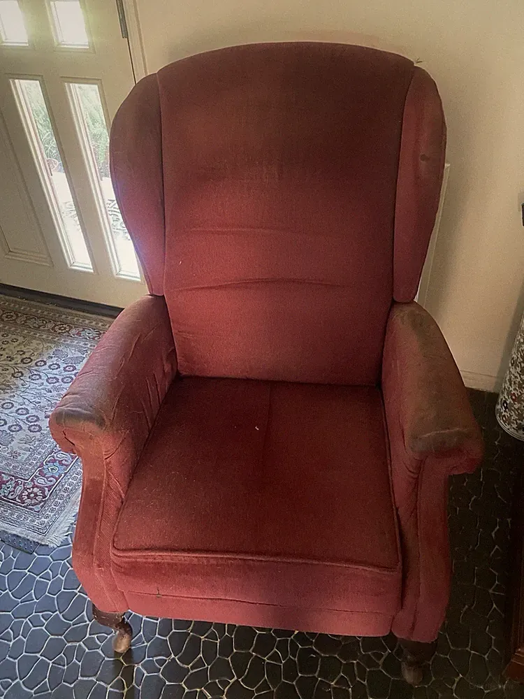 Comfortable reclining arm chair.
